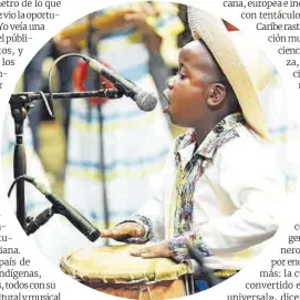  ??  ?? Un joven músico en el Festival Petronio Álvarez, en Cali.