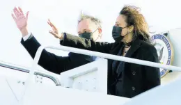 ?? AP ?? Vice–President Kamala Harris and her husband, Doug Emhoff, wave as they board Air Force Two at Andrews Air Force Base, Maryland, yesterday.