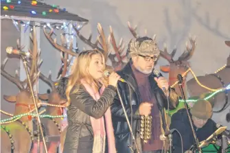  ?? CAPE BRETON POST • FILE ?? Singer John Gracie and his daughter Samantha perform at their annual Christmas concert at Sydney's Wentworth Park in 2016. The concert has been cancelled this year due to COVID-19 concerns but hopes to return next year.