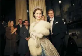  ?? ROBERT VIGLASKY — NETFLIX VIA AP ?? This image released by Netflix shows Claire Foy, center, and Matt Smith, right, in a scene from “The Crown.” The New York Times website recaps each episode of “The Crown” in text stories, but it goes the extra mile. Through the miracle of hyperlinks...