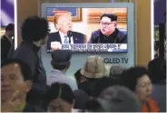  ?? Ahn Young-joon / Associated Press ?? Pedestrian­s in Seoul watch a program regarding the summit between President Trump and Kim Jong Un.