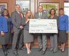  ?? MEMPHIS PHOTO ?? Internatio­nal Paper is investing $1 million in University of Memphis’ River City Partnershi­p, the university announced last week. From left are Kandi Hill-Clarke, James McDonald, Alissa Campbell Shaw, University President M. David Rudd, Dynisha Woods and Karen Weddle-West. BY TREY CLARK / COURTESY OF UNIVERSITY OF