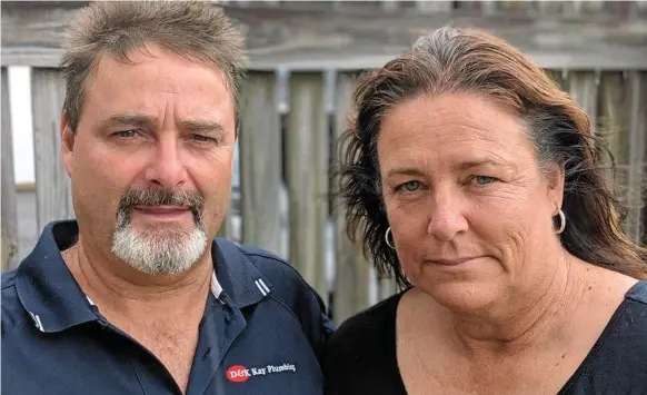  ??  ?? Darrell and Katrina Kay of D&amp;K Kay Plumbing in Mackay were impacted by the collapse of JM Kelly.