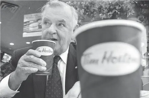  ?? AARON HARRIS / THE CANADIAN PRESS FILES ?? Ron Joyce came from humble origins to build a fortune from the Tim Hortons coffee and doughnut empire.