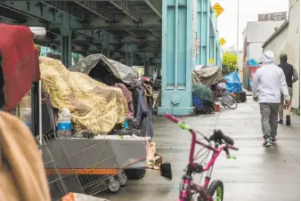  ?? Jessica Christian / The Chronicle ?? A homeless encampment along 13th Street last month in San Francisco. With no guarantee of permanent housing, many homeless people believe the street is their best option.