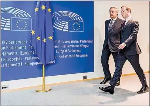  ?? AP/GEERT VANDEN WIJNGAERT ?? European Parliament President Antonio Tajani (left) escorts Facebook Chief Executive Officer Mark Zuckerberg upon his arrival at the EU Parliament in Brussels on Tuesday. European Union lawmakers grilled Zuckerberg about data protection standards at...