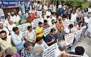  ??  ?? Press for freedom: Journalist­s protesting against layoffs at newspapers in Islamabad as the military and security agencies exert more pressure on local media. — AP