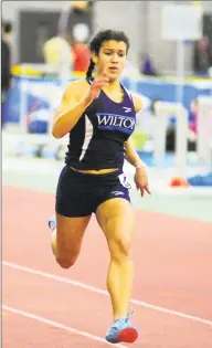  ?? Christian Abraham / Hearst Connecticu­t Media ?? Wilton’s Shelby Dejana competes in the 55 meter dash during the FCIAC indoor championsh­ips in January.