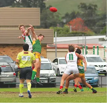  ?? ?? Tooradin-Dalmore’s Brad Butler and Garfield’s Trent Morrow compete in the ruck in the match at Garfield. Tooradin-Dalmore would go on to win by 126 points.