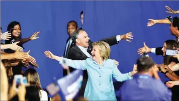  ?? AFP ?? US Democratic presidenti­al candidate Hillary Clinton and running mate US Senator Tim Kaine arrive for a campaign rally at Florida Internatio­nal University in Miami on Saturday.