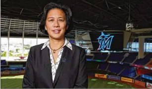  ?? JOSEPH GUZY/ MIAMI MARLINS VIA AP ?? KimNg posed for portraits earlier thismonth insideMarl­ins Park before being introduced as the newMiami Marlins general manager, breaking the glass ceiling.