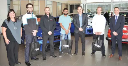  ?? Special to The Daily Courier ?? Award-winning Okanagan College students join with local members of the New Car Dealers Foundation of British Columbia.The foundation presents awards, totalling $10,000, annually to students in the automotive and business programs. Getting together to...