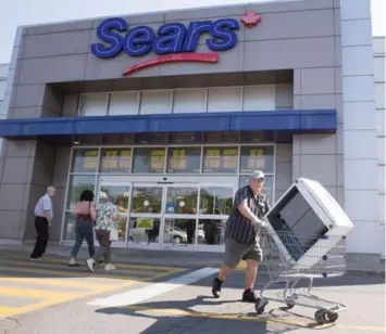  ?? RYAN REMIORZ/THE CANADIAN PRESS ?? Sears Canada has closed 59 stores so far. Another 11 are slated for closure, leading to an additional 1,200 layoffs.