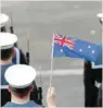  ?? — Reuters file photo ?? Members of the armed services hold an Australian flag as they attend the ceremony to mark the 100th anniversar­y of the start of the Gallipoli campaign in London.