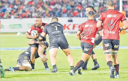  ?? Picture: FILE ?? Sevu Reece (left) of the Crusaders runs into heavy traffic against the Gallagher Chiefs during their Super Rugby clash at the ANZ Stadium in Suva in 2018.