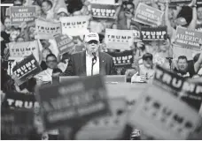  ?? BILL PUGLIANO, GETTY IMAGES ?? In front of a mostly white audience on Aug. 19, Trump asks blacks to vote for him: “What the hell do you have to lose?”