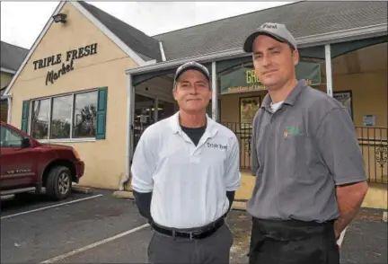  ?? PETE BANNAN — DIGITAL FIRST MEDIA ?? Jim Petro Jr. and Jim Petro III are celebratin­g the 30th anniversar­y of their store, Triple Fresh on Doe Run Road in East Fallowfiel­d.