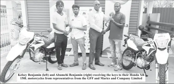  ?? ?? Kelsey Benjamin (left) and Abumchi Benjamin (right) receiving the keys to their Honda XR 150L motorcycle­s from representa­tives from the GFF and Marics and Company Limited