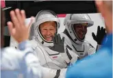  ?? Associated Press ?? NASA astronauts Douglas Hurley, left, and Bob Behnken head to the launch pad Wednesday in Cape Canaveral, Fla.