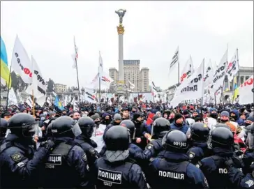  ?? AFP ?? Kiev police said in a statement that forty officers suffered chemical burns to their eyes on Maidan (Independen­ce) Square after protesters also used tear gas.