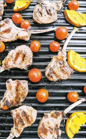  ?? Gretchen McKay/Post-Gazette photos ?? The grill comes in handy to cook finger foods. Above: lamb chops; right from top: Parmesan bowls, stuffed mushrooms and shrimp toasts.