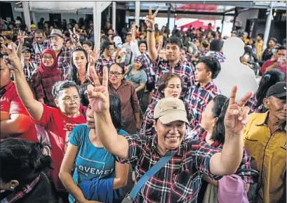  ?? Picture: GETTY IMAGES ?? SHOWING SUPPORT: Supporters of Basuki Tjahaja Purnama cheer after hearing his speech during the voting in Jakarta, Indonesia
