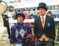  ?? Rex Features ?? Michael Owen (right) at Epsom in 2005, when his horse ‘Evolution Ex’ finished fourth in the opening race at the Derby.