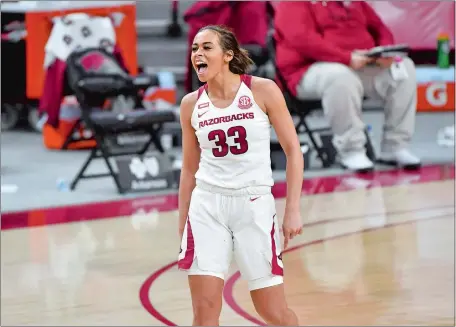  ?? MICHAEL WOODS/AP PHOTO ?? Arkansas guard Chelsea Dungee celebrates after hitting a shot against during the No. 19 Razorbacks’ 90-87 upset of No. 3 and previously unbeaten UConn on Thursday night in Fayettevil­le, Ark. Dungee scored a game-high 37 points.