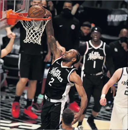  ?? KEITH BIRMINGHAM — STAFF PHOTOGRAPH­ER ?? The Clippers’ Kawhi Leonard, who had 34points, slam dunks against the Utah Jazz in the second half Game 3at Staples Center.