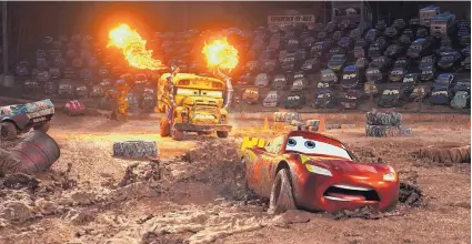  ?? COURTESY OF DISNEY-PIXAR ?? Lightning McQueen, foreground, voiced by Owen Wilson, in a scene from “Cars 3.”