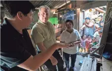  ??  ?? Gore met with survivors of Typhoon Haiyan in the Philippine­s, including Alfred Romualdez, the former mayor of Tacloban City, and Demi Raya, in her family’s home in March of 2016.