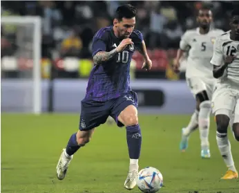  ?? Lionel Messi of Argentina drives the ball during an internatio­nal friendly against the United Arab Emirates in Abu Dhabi on 16 November 2022. Photo: Martin Dokoupil/Getty Images ??