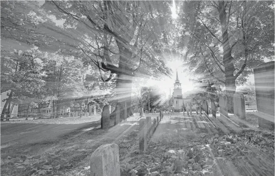  ?? Robert F. Bukaty / Associated Press ?? Autumn's colors peak on trees in a cemetery near the Congregati­onal Church in Cumberland, Maine. The history of the Congregati­onal Church is the history of Colonial New England. Its records from 1630 to 1800 are being put online by the Boston-based...