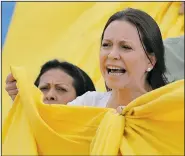  ?? AP/FERNANDO LLANO ?? Opposition leader Maria Corina Machado holds a Venezuelan flag Monday in Caracas during a protest against Sunday’s election.