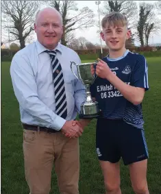  ??  ?? Wicklow Coiste na nÓg Chairman Pat Dunne presents the ‘A’ hurling Féile Cup to James Boland of Michael Dwyers.