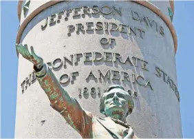  ?? STEVE HELBER/AP ?? A statue commemorat­es Confederat­e President Jefferson Davis on Richmond’s Monument Avenue, a national historic landmark.
