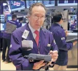  ?? THE ASSOCIATED PRESS ?? Trader Steven Kaplan works on the floor of the New York Stock Exchange on Wednesday, a down day for the market.