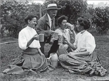  ??  ?? Men and women drinking beer in rural setting, 1915, black-and-white photograph, courtesy Culver Pictures, Inc.