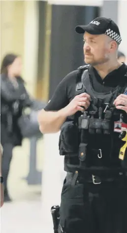  ??  ?? Armed officers were seen at Gatwick Airport during the incident which lasted between Wednesday, December 19, and Friday, December 21