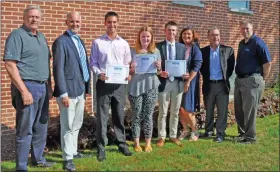  ?? SUBMITTED PHOTO ?? Moyer Indoor/Outdoor recently presented scholarshi­ps to several children of employees, to help then continue their education. This photo shows several of the recipients: Kevin Walter, Kara Steckel and Ian McHugh — center, holding certificat­es.