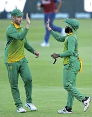  ?? /ASHLEY VLOTMAN/GALLO IMAGES ?? David Miller and Proteas ODI captain Temba Bavuma celebrate the fall of a wicket in previous action.
