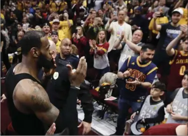  ?? TONY DEJAK — THE ASSOCIATED PRESS ?? LeBron James blows kisses as he walks off the floor after a 128-93 victory over the Toronto Raptors in Game 4 of Cleveland’s Eastern Conference semifinal in Cleveland.