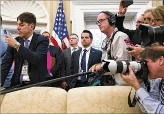  ?? DOUG MILLS / NEW YORK TIMES ?? Still serving as White House communicat­ions director, Anthony Scaramucci (center) is surrounded by reporters while President Donald Trump meets with John Kelly, his new chief of staff, in the Oval Office on Monday. A short time later, Scaramucci was...