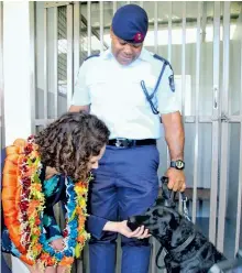  ?? Photo: Ashna Kumar ?? New Zealand Acting High Commission­er Halia Haddad meets K9 Conan with his handler Police Constable Iowane Serunituac­oko during the opening of the Fiji Dog Detector Unit Suva Complex in Nasese, Suva on January 25, 2018.