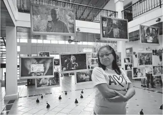  ??  ?? Josefa Meza stands at the Asociación Madres de Abril exhibit in Managua, Nicaragua. Meza’s son was among the student protesters killed during the Mother’s Day March on May 30, 2018, in Managua.