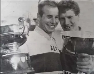  ??  ?? Kiltegan Intermedia­te captain Eugene Byrne and Senior captain Ciaran O’Keeffe after both teams won their county finals on the same day in Aughrim in 1995.