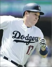  ?? Alex Gallardo Associated Press ?? A.J. ELLIS was beloved by many of his Dodgers teammates but he was traded away Thursday.