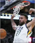  ?? DAVID J. PHILLIP AND RICK BOWMER— THE ASSOCIATED PRESS FILE ?? Malcolm Brogdon, shooting left, and Rudy Gobert, right, were both reportedly on the move. The Pacers agreed to trade Brogdon to the Celtics and the Jazz sent Gobert to Minnesota for a bevy of first-round draft picks.