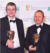  ??  ?? Filmmaker Jonathan Hodgson and producer Richard Van Den Boom pose with their awards for a British Short Animation for ‘Roughhouse’.
