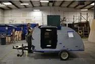  ?? Hyoung Chang, The Denver Post ?? Derrick Halls assembles trailers at Colorado Teardrops manufactur­ing plant in Boulder.